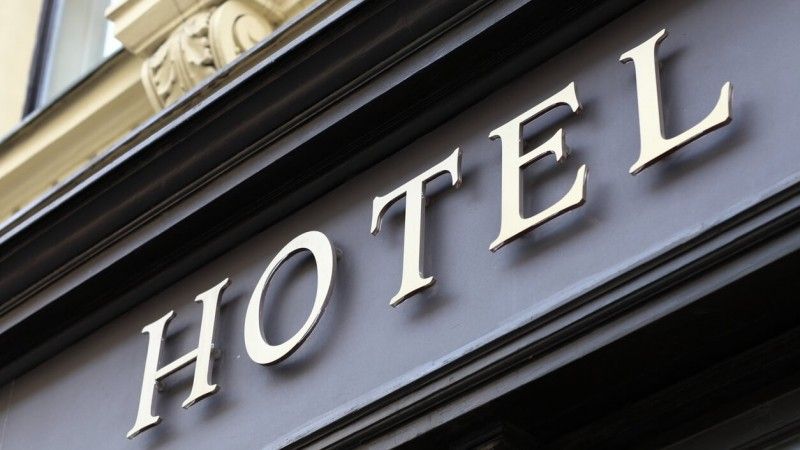 2023/01/gold-sign-on-exterior-of-hotel.jpg