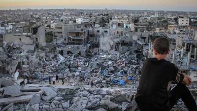 2023/11/202472_a_palestinian_child_sits_above_the_ruins_of_his_ruined_home_0.jpg
