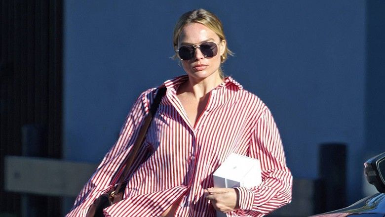 2024/01/Margot-Robbie-keeps-it-casual-in-a-striped-shirt-.jpg