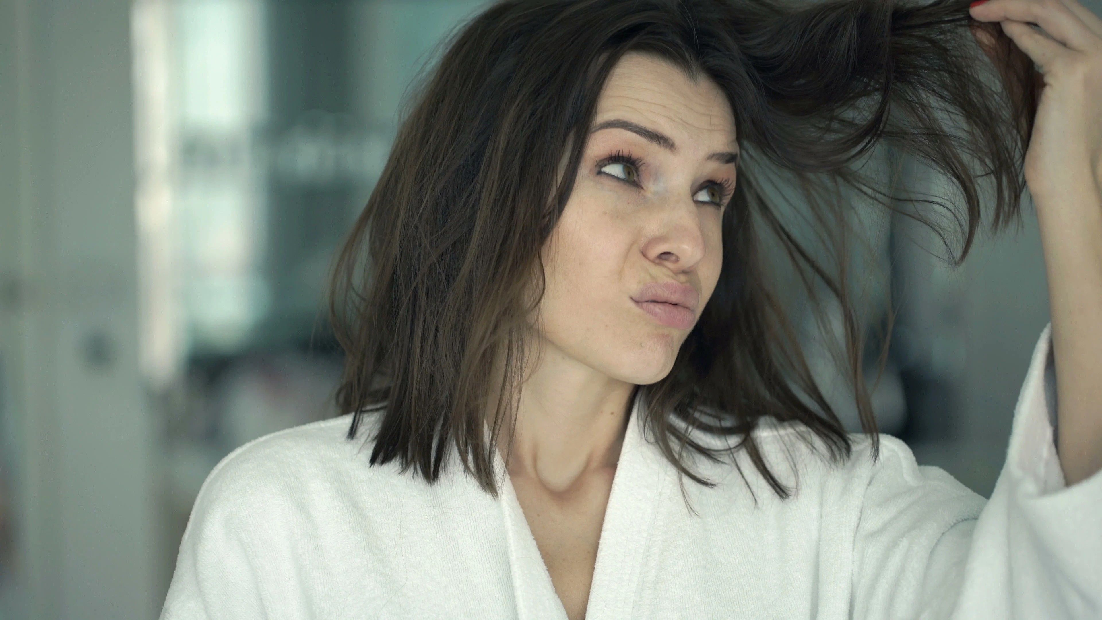 2024/04/unhappy-woman-bathrobe-checking-her-074912360_prevstill-scaled.jpg