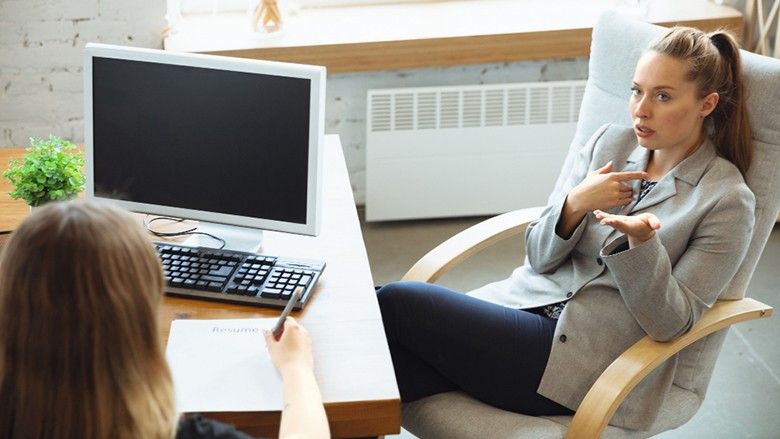 2024/10/young-woman-sitting-in-office-during-the-job-interview-with-female.jpg