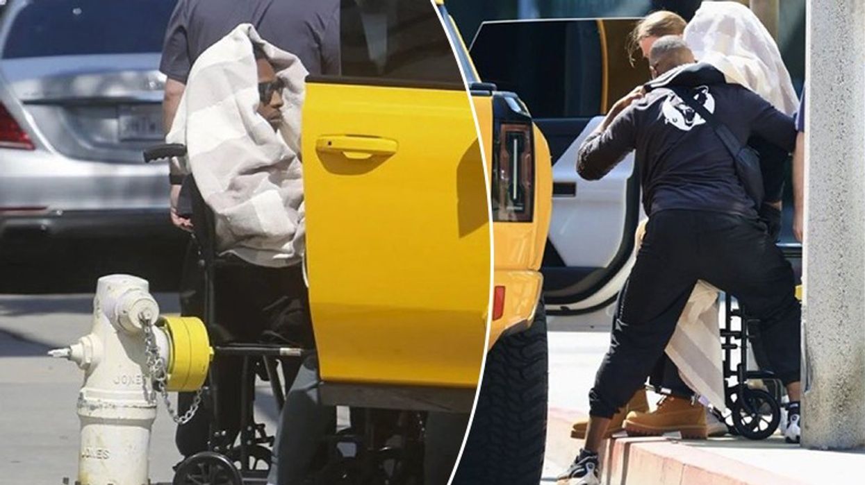 ASAP Rocky filmohet në një karrocë me rrota, truprojat e ndihmojnë të hipë në veturë