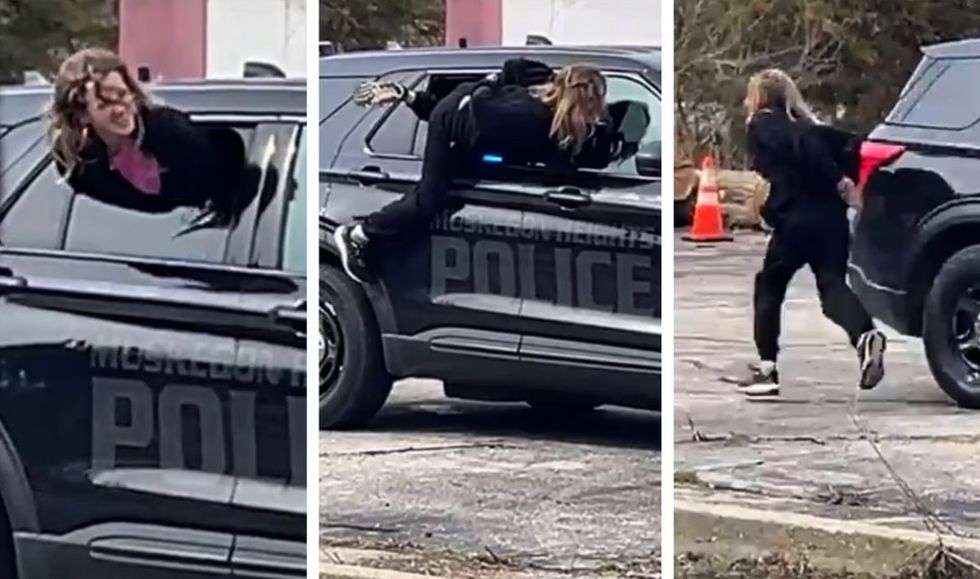 Gruaja arratiset guximshëm nga policët e Michiganit duke u larguar nëpër dritaren e makinës së policisë