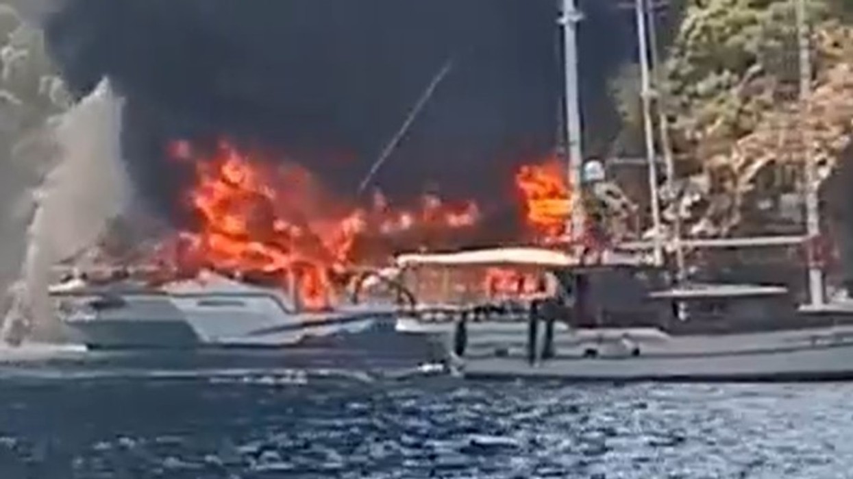 Over 100 tourists jump into sea after boat catches fire in Turkey