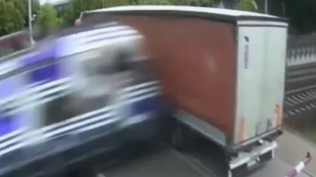 Shocking moment in Poland - train hits truck at railway crossing