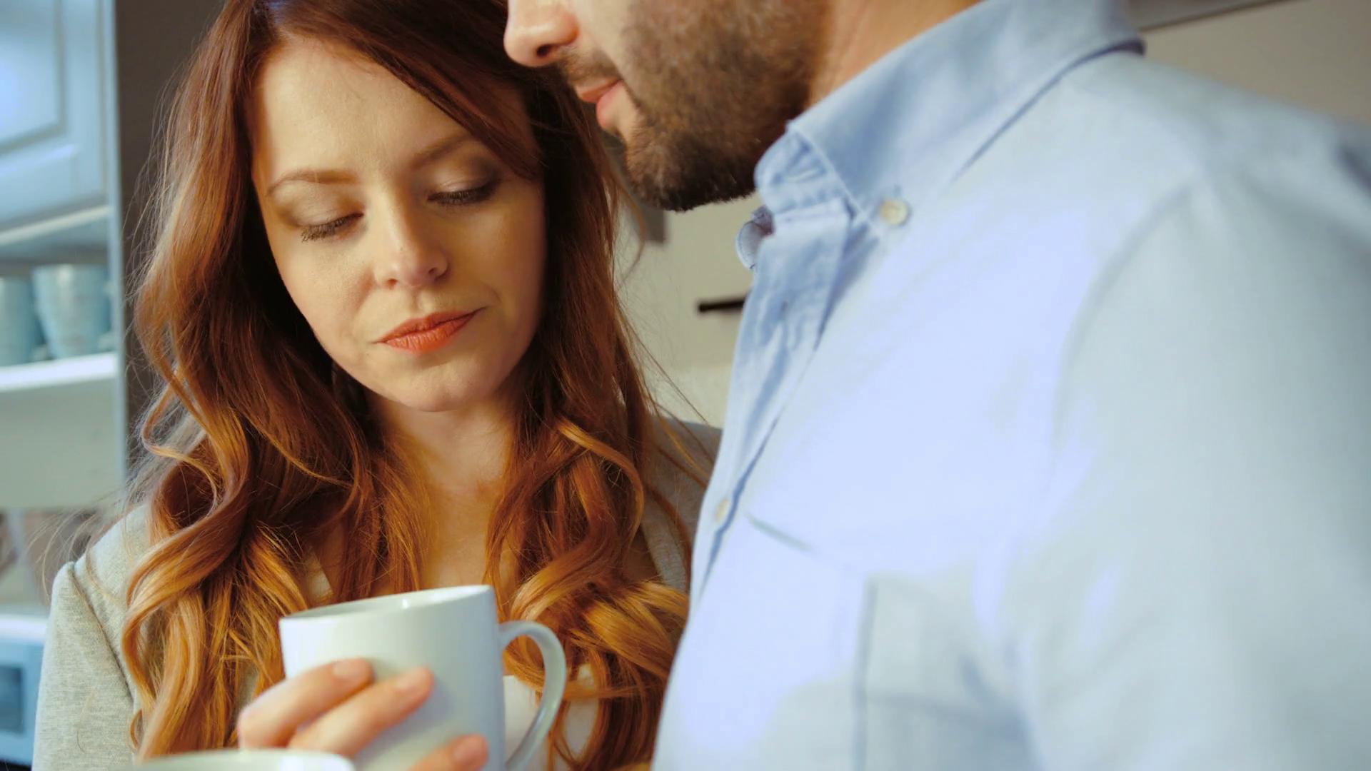 2019/10/videoblocks-happy-caucasian-young-woman-and-her-husband-drinking-coffee-on-kitchen-background-close-up-.png