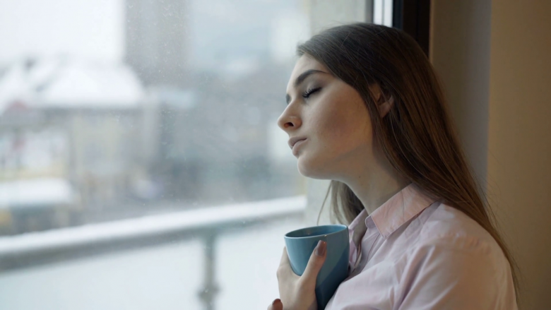 2024/03/videoblocks-sad-depressed-woman-drinking-tea-by-the-w-123.png