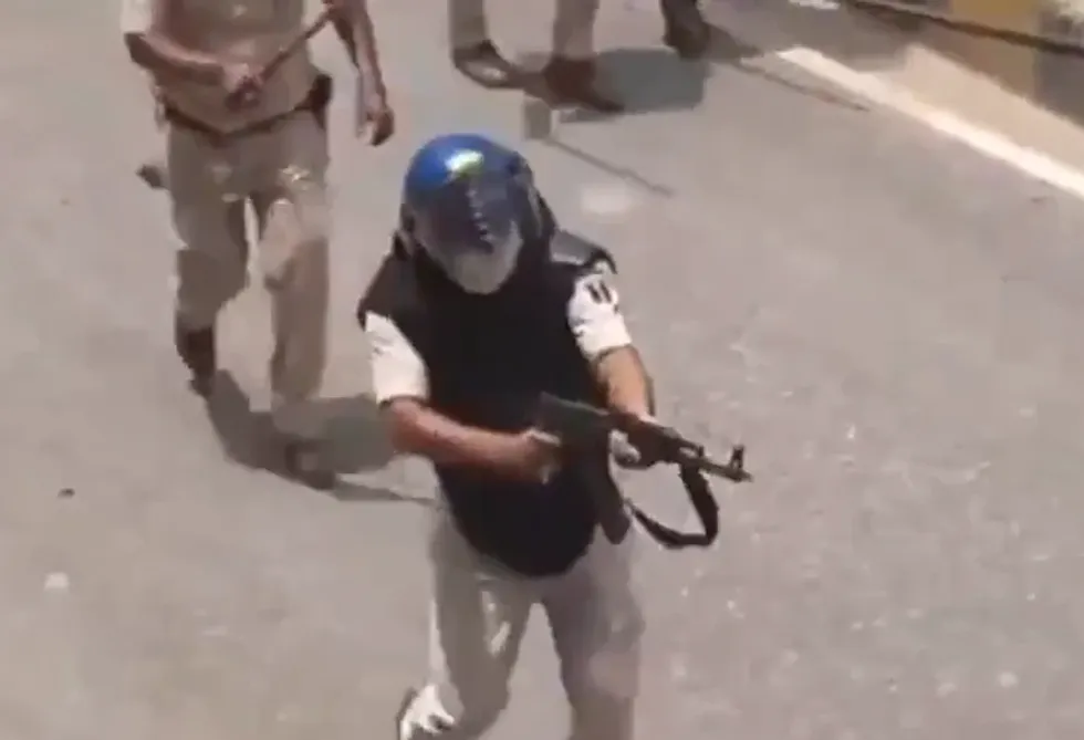 India suspends policeman for firing AK-47 at student protesters