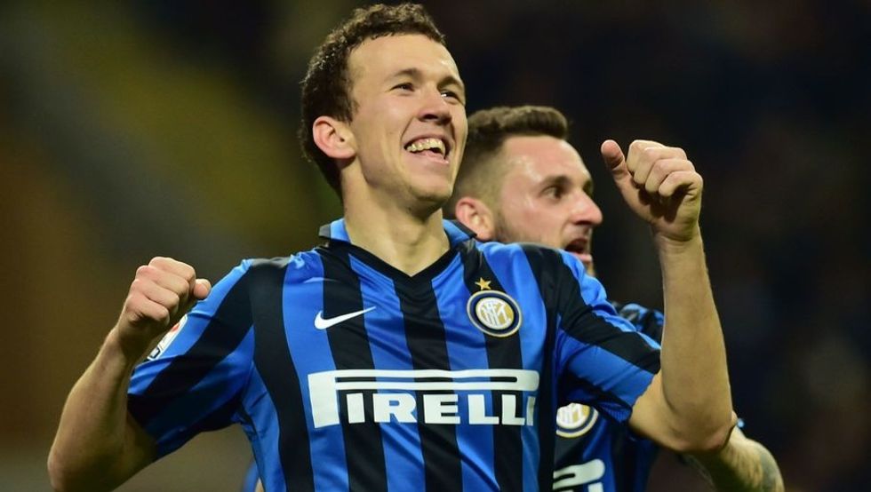 Inter Milan's forward from Croatia Ivan Perisic celebrates after scoring a goal during the Italian Serie A football match between Inter Milan and Bologna at the San Siro Stadium in Milan on March 12, 2016. / AFP / GIUSEPPE CACACE (Photo credit should read GIUSEPPE CACACE/AFP/Getty Images)