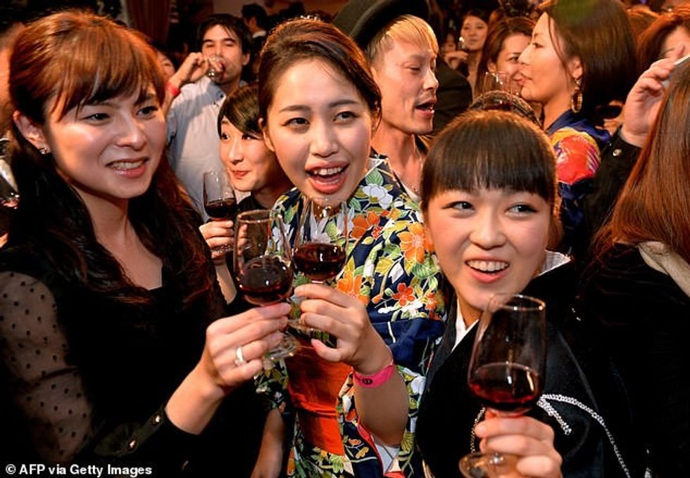 Japan tells its sober youth to drink MORE in bid