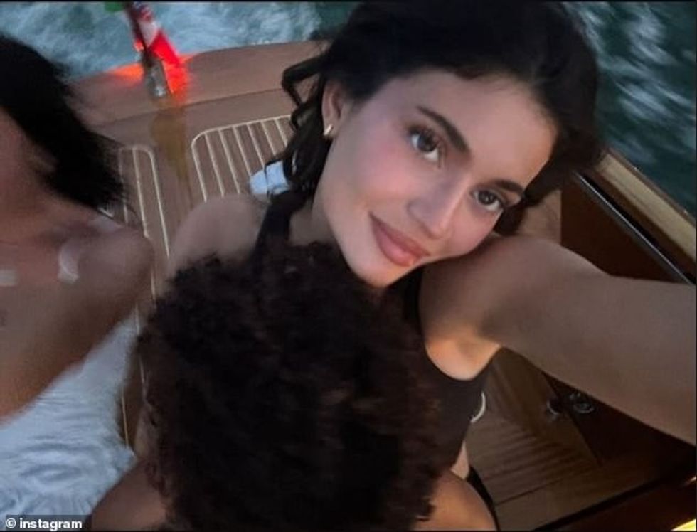 Jenner also shared an image of her six-year-old daughter Stormi sitting in her lap, with only her head of curls showing