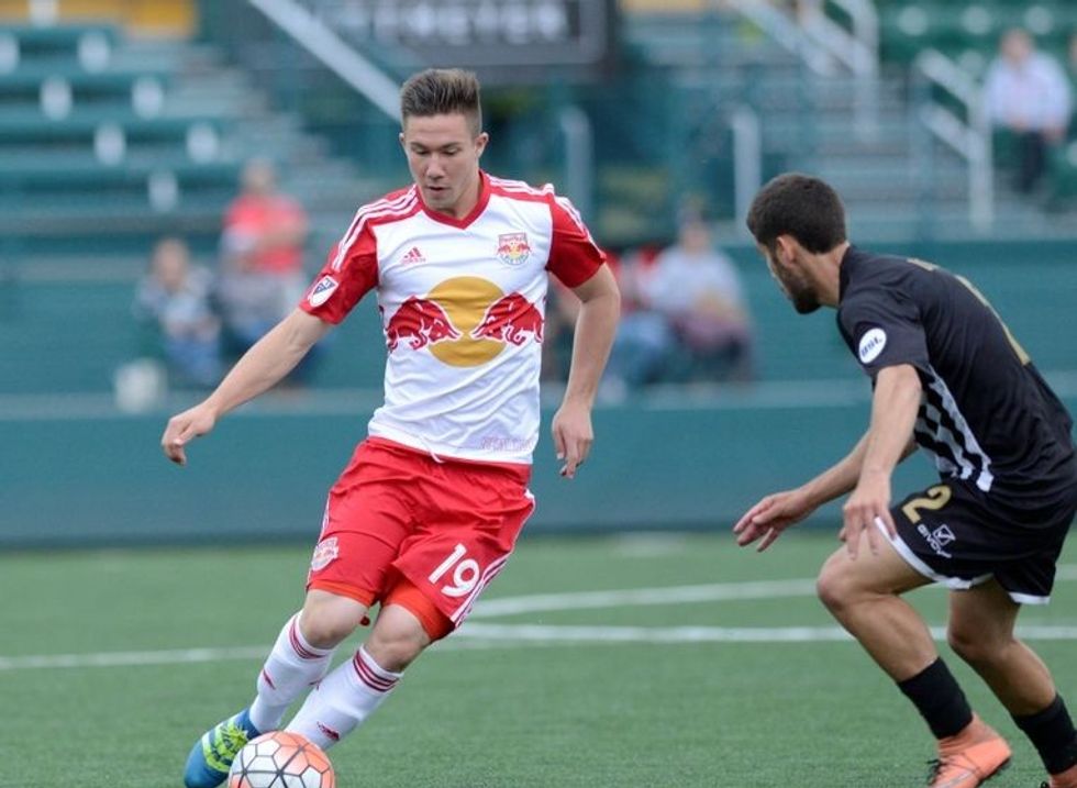 Jun 15, 2016; Rochester, NY, USA; New York Red Bulls forward Alex Muyl (19) works with the ball as Rochester Rhinos midfielder Marcos Ugarte (2) defends during the first half of a U.S. Open Cup game at Rhinos Stadium. New York won 1-0. Mandatory Credit: Mark Konezny-USA TODAY Sports