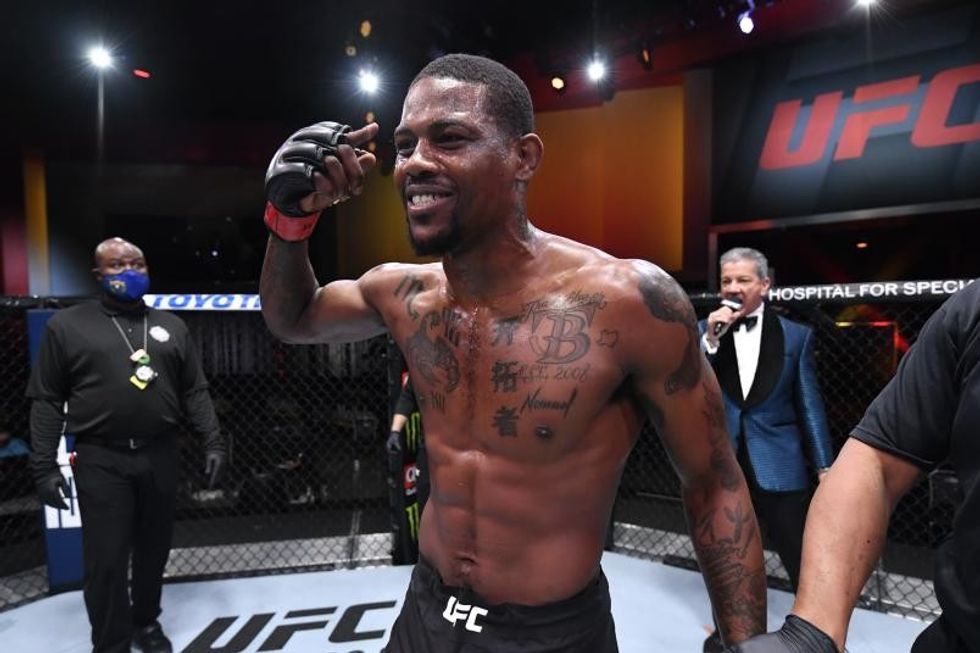 Kevin Holland celebrates his KO victory over Jacare Souza of Brazil in their middleweight bout during the UFC 256 event at UFC APEX on December 12, 2020 in Las Vegas, Nevada. (Photo by Jeff Bottari/Zuffa LLC)