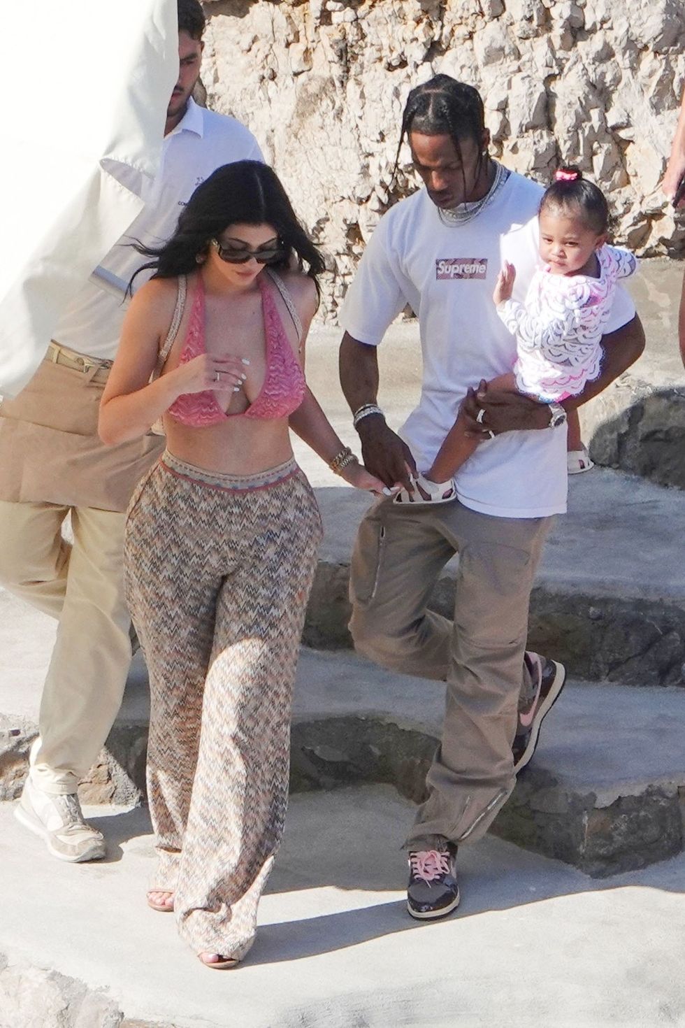 kylie wears a pink lace top with travis and stormi 2