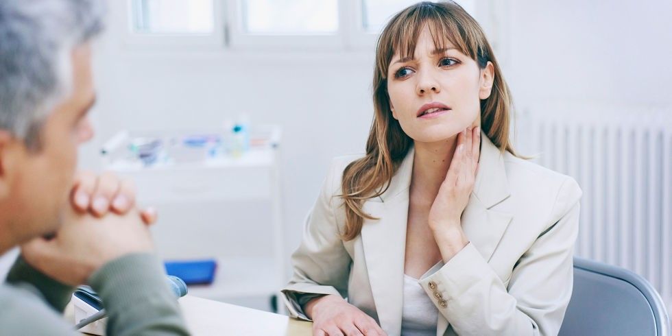 landscape-1457107744-womanholdingthroat