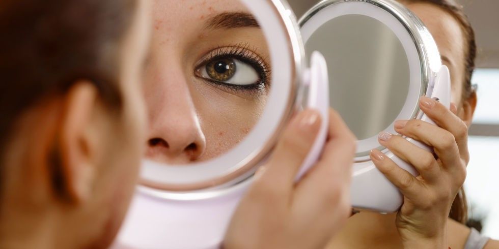 landscape 1462876212 woman lookiung into mirror