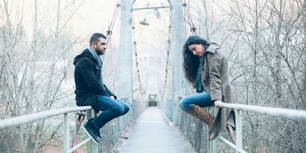 landscape 1478260328 unhappy couple sitting on bridge