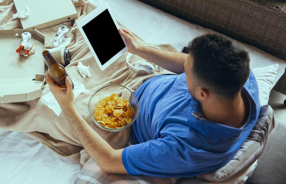 lazy man living whole life his bed surrounded with messy2 scaled 1