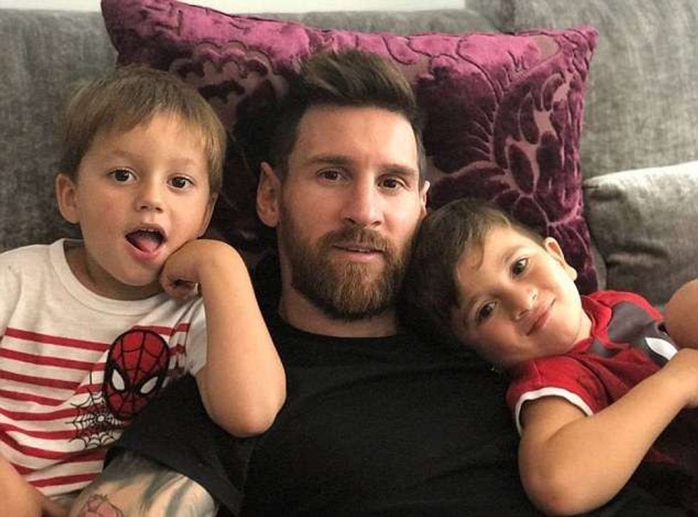 Lionel Messi with his sons Thiago and Mateo