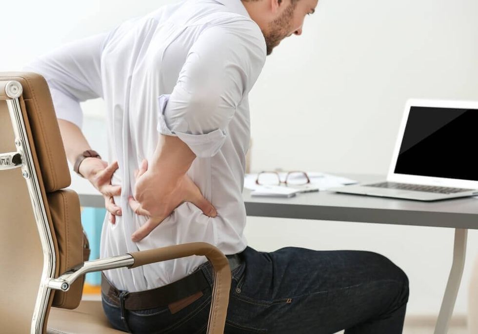 lower back and testicle pain when sitting