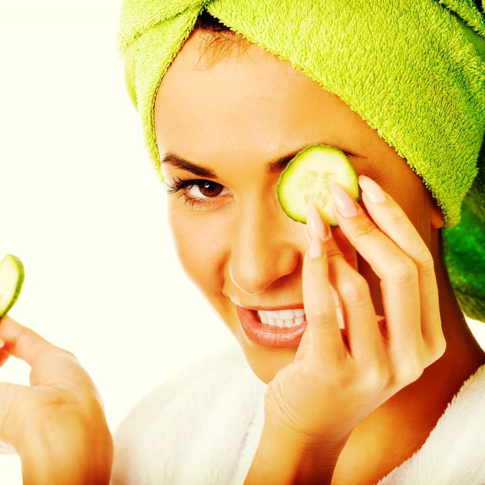 M1 Blog 1 Woman in bathrobe applying cuc 178693498