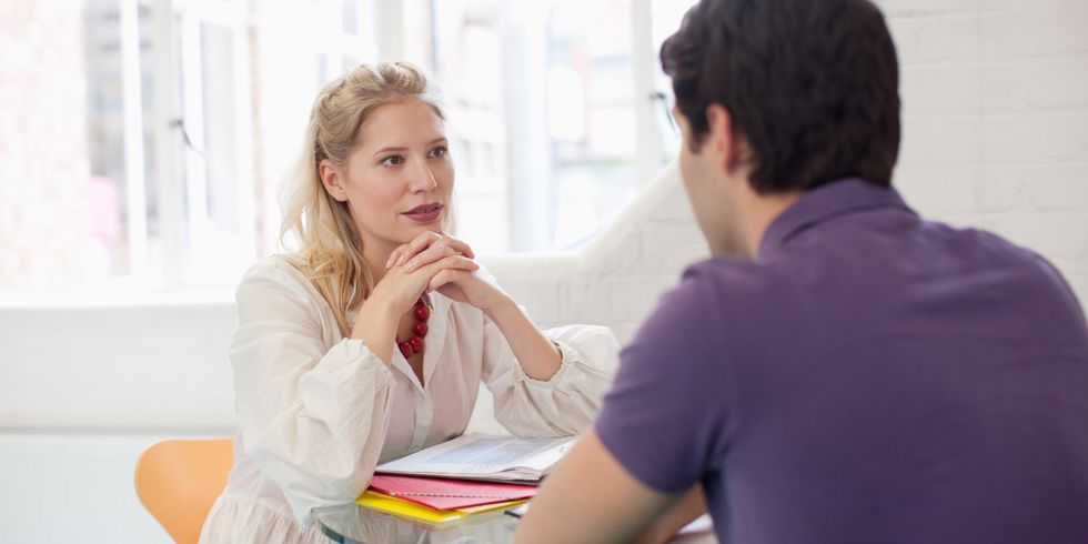 Man and woman talking at table
