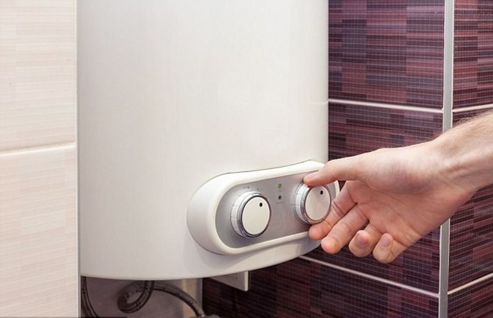 man checking boiler remotely main 386083