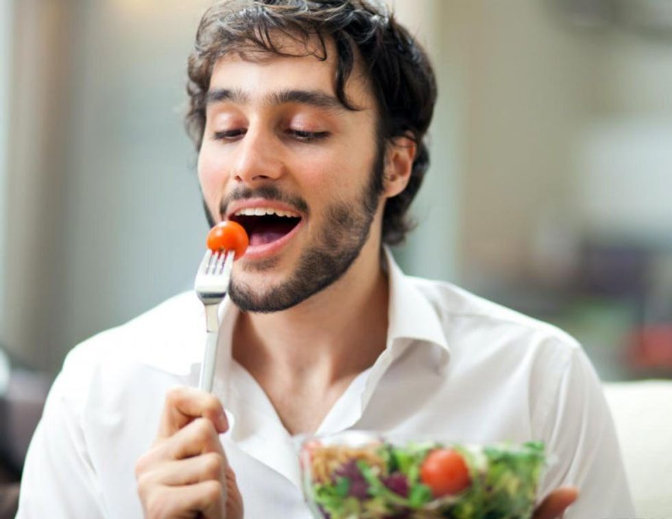 man eating salad