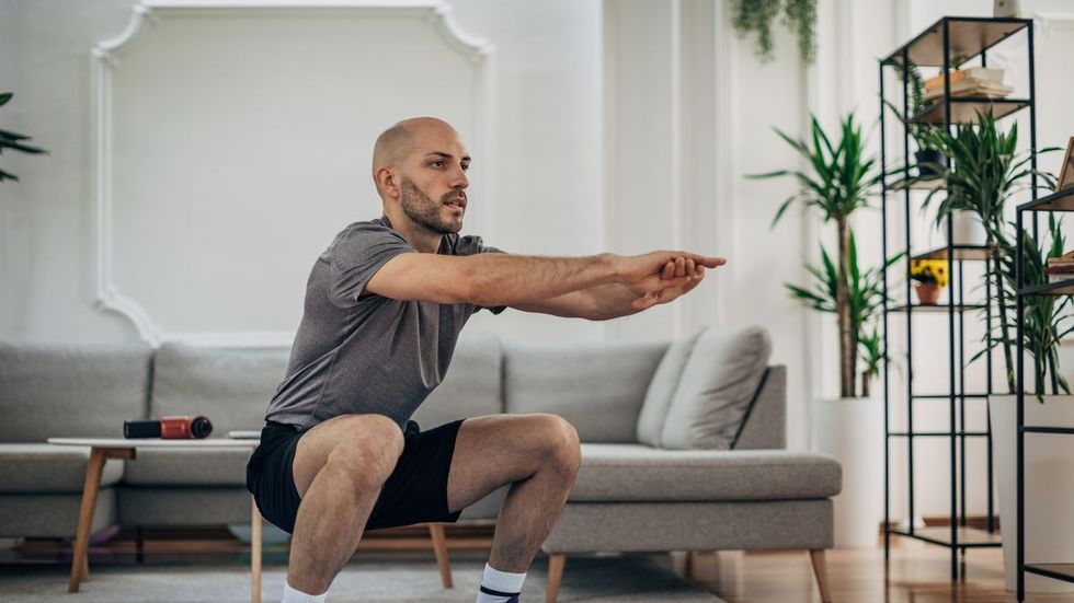 man exercising at home royalty free image 1669761449