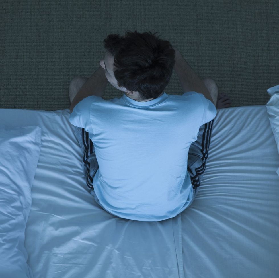 man sitting on bed unable to sleep royalty free image 103058329 1547758543