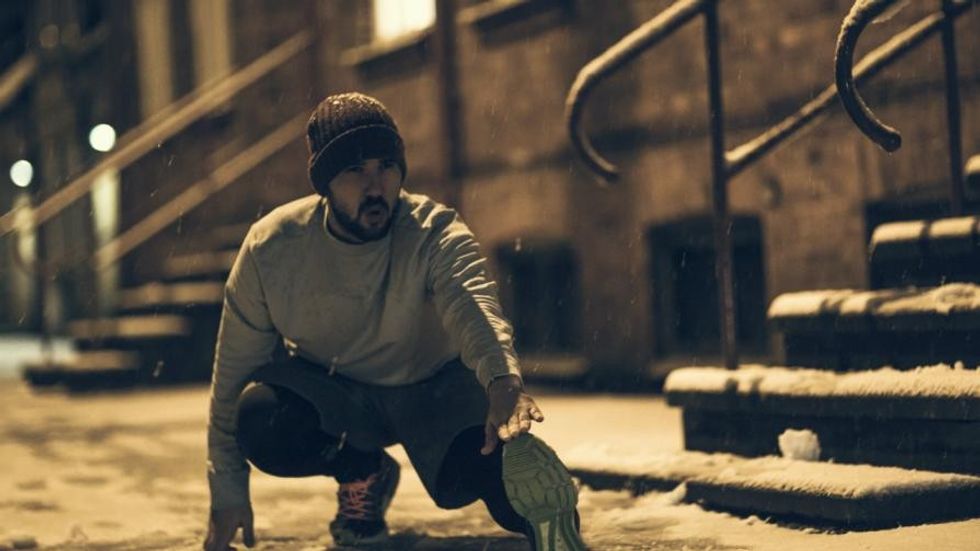 man stretching cold outside 1109