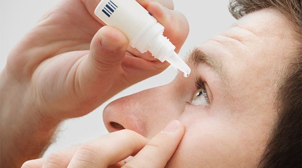man-uses-eye-drop-