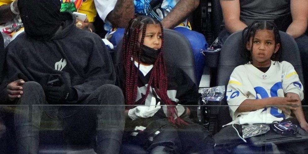 Masked Kanye West takes kids to Super Bowl 2022 after 1 1