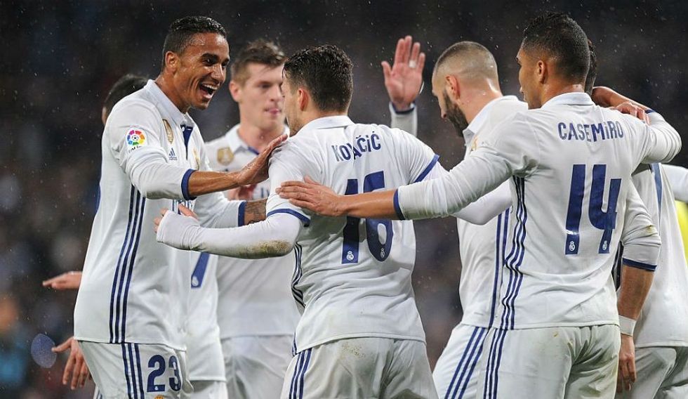 Mateo Kovacic of Real Madrid celebrates with Danilo after scoring Reals 1st goal during the La Liga match between Real Madrid CF and Real Sociedad