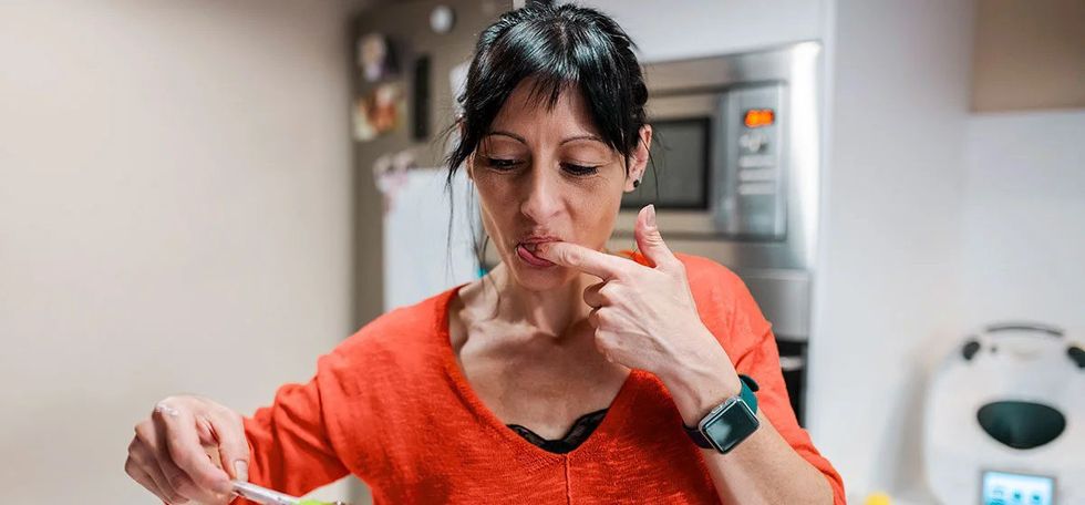 mature female eating chocolate on s