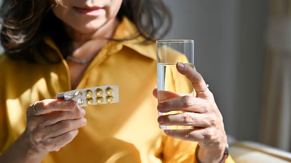 mature female looking at blister pack 1296 728 header