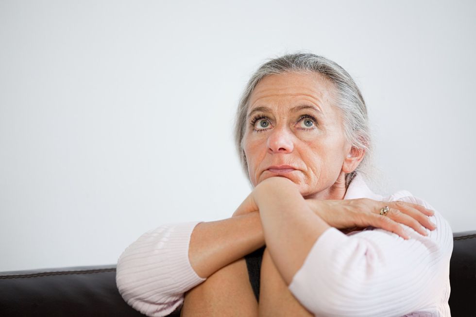 Mature woman looking anxious