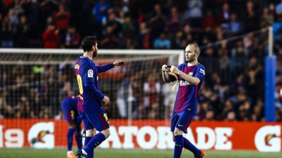 messi iniesta