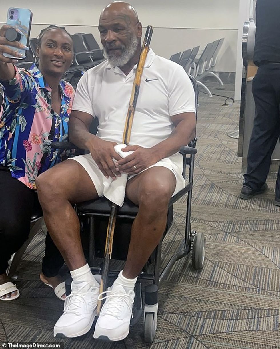 Mike Tyson was pictured in a wheelchair at Miami International Airport on Tuesday