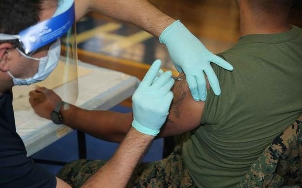 mil marine receives vaccine dose 1800 e1613717823890