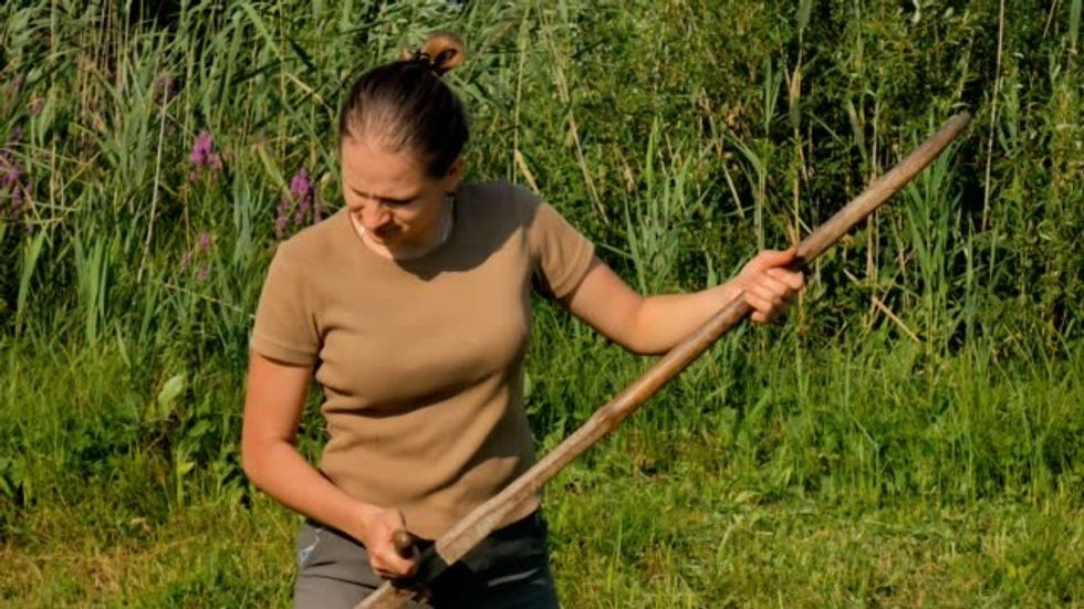mowing with a scythe