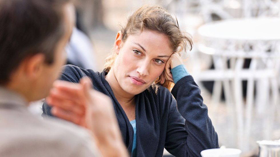 NB MRs. A woman listening to a man (defocussed) talking during a discussion Taken during iStockalypse Milano, 2011.