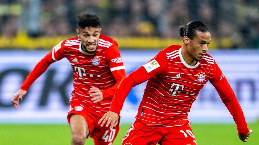 noussair mazraoui and leroy sane in action for bayern munich