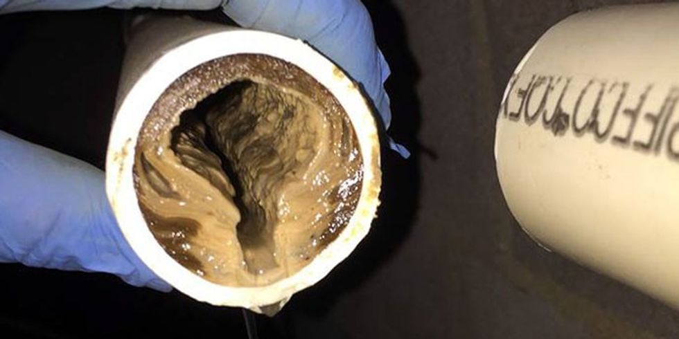 old oil poured into kitchen sink