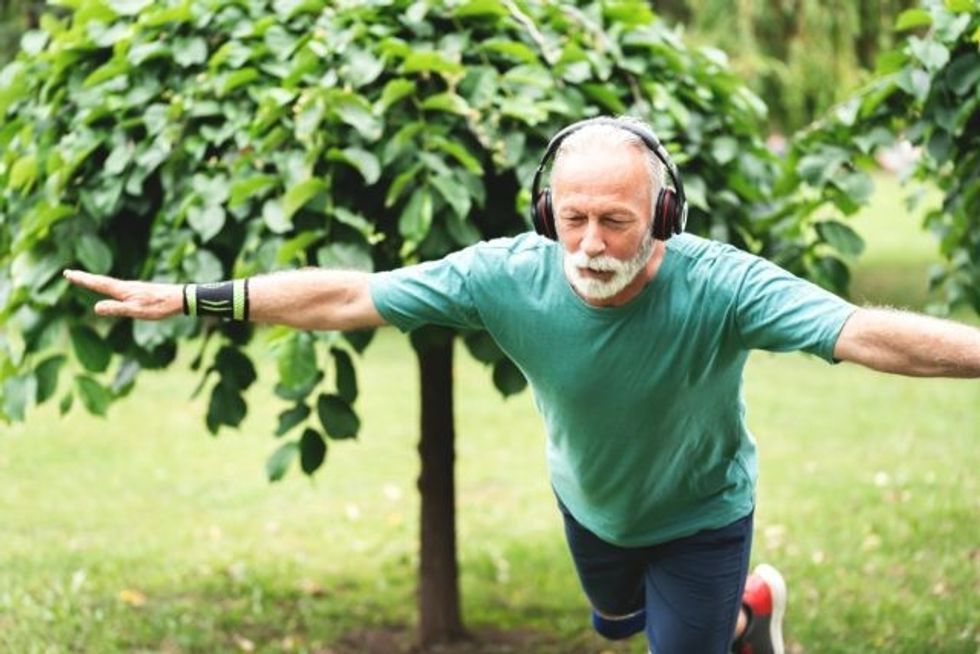 older man standing one leg