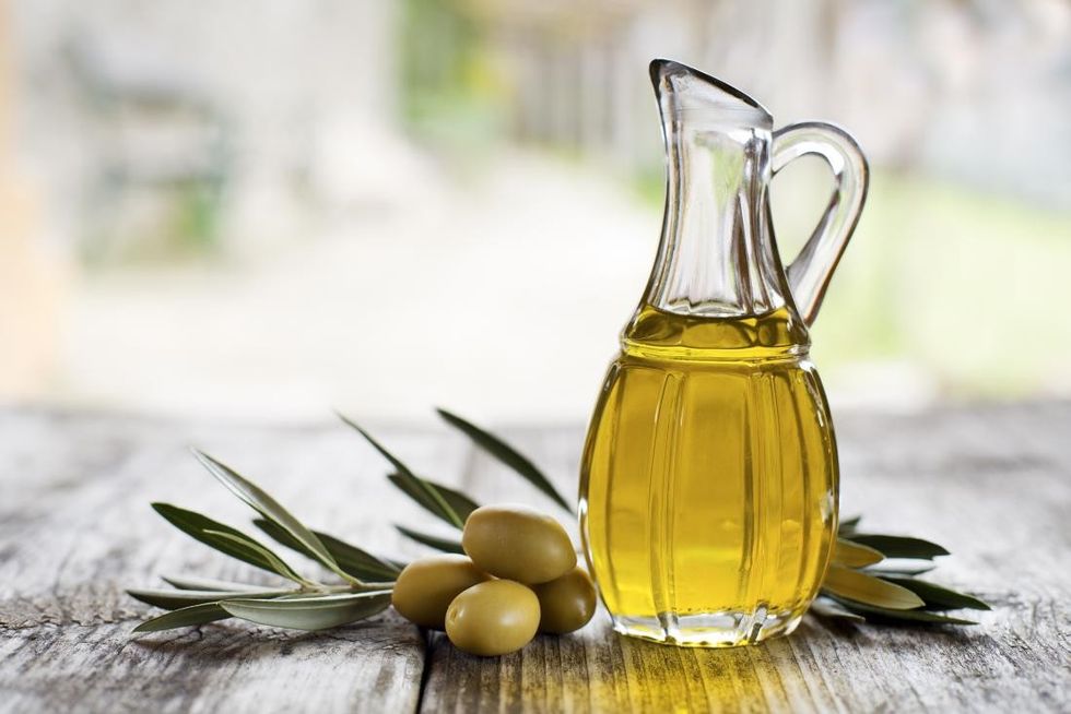 olive oil in a bottle which may be used on the face