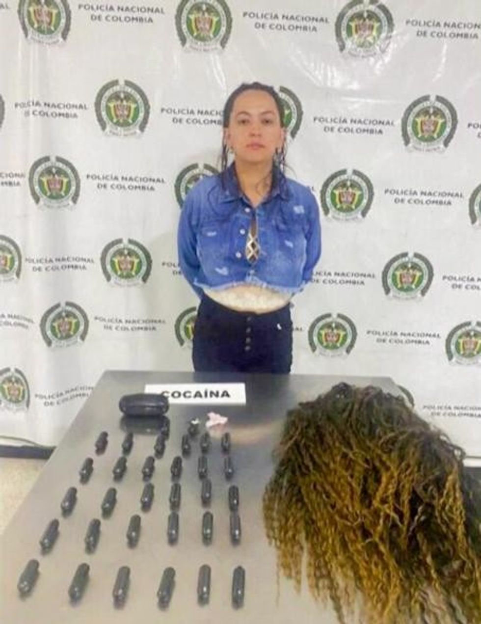 One of the suspects pictured alongside the drugs and hair extensions used for the smuggling operation.