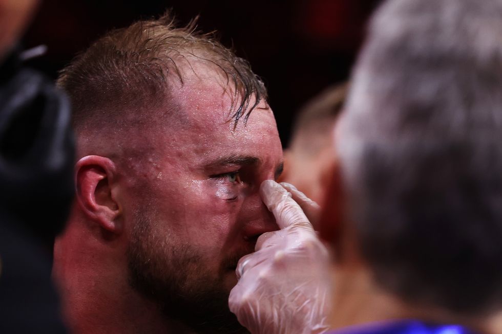 Otto Wallin receives medical treatment after his defeat to Anthony Joshua