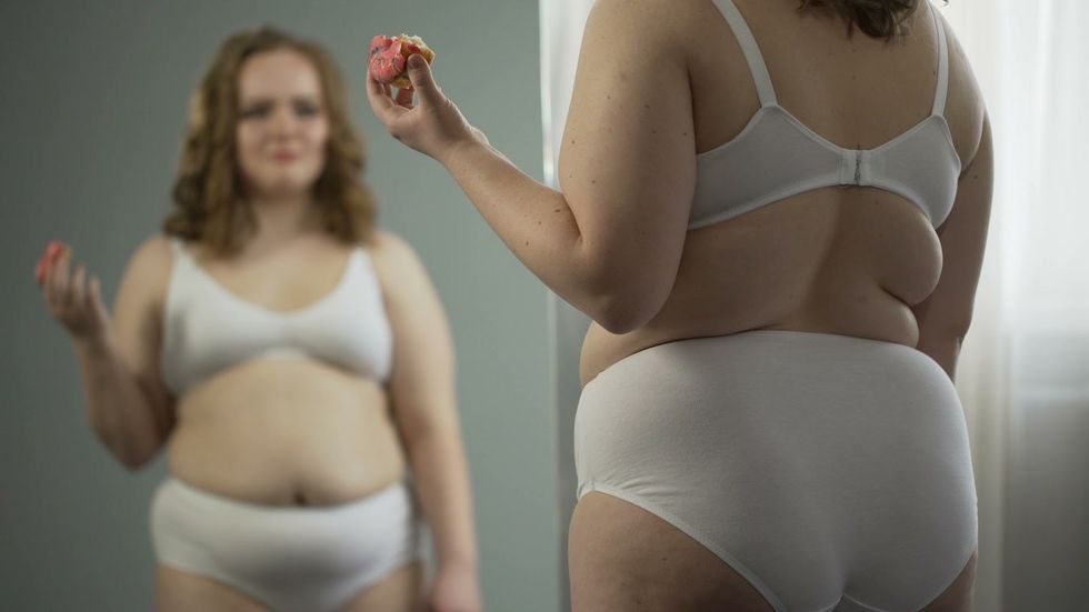 overweight young woman stress eating footage 074939030 prevstill