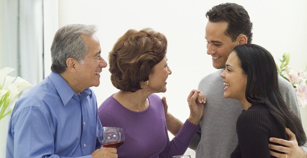 Parents Chatting with Child and Spouse
